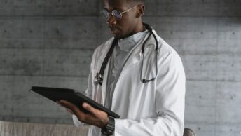 A Doctor Using a Tablet
