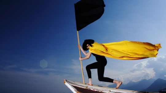 Woman Holding Black Flag