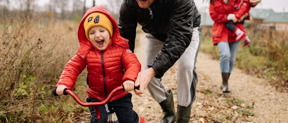 Father Teaching His Son How to Ride a Bike