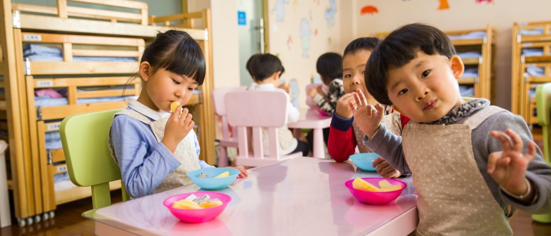 Three Toddler Eating on White Table