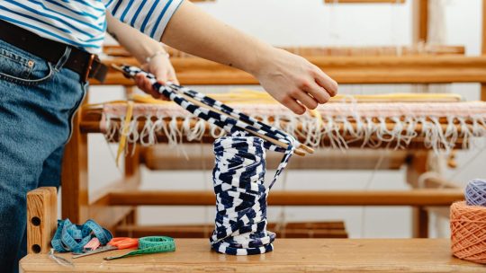 Hands of a Female Weaver at Work